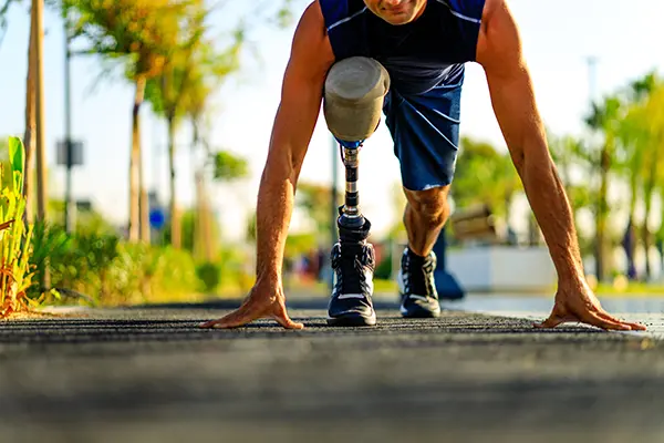 man running with prosthetic leg